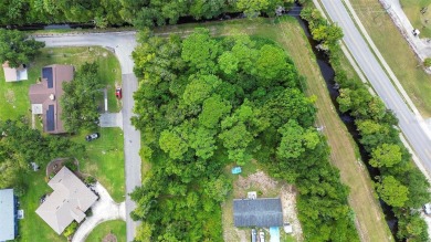 Nestled in the heart of New Smyrna Beach, this treed buildable on New Smyrna Beach Golf Course in Florida - for sale on GolfHomes.com, golf home, golf lot