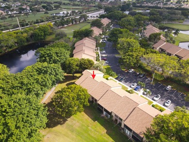 Enjoy serene views from this charming 1st floor 2BR/2BA + Den on Boca Delray Golf and Country Club in Florida - for sale on GolfHomes.com, golf home, golf lot