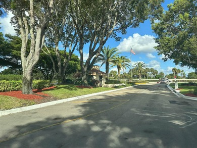 Enjoy serene views from this charming 1st floor 2BR/2BA + Den on Boca Delray Golf and Country Club in Florida - for sale on GolfHomes.com, golf home, golf lot