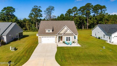 This beautifully crafted home combines refined finishes with on Minnesott Golf and Country Club in North Carolina - for sale on GolfHomes.com, golf home, golf lot