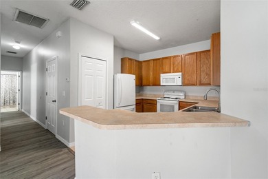 One or more photo(s) has been virtually staged. Step into a home on The Links of Lake Bernadette in Florida - for sale on GolfHomes.com, golf home, golf lot