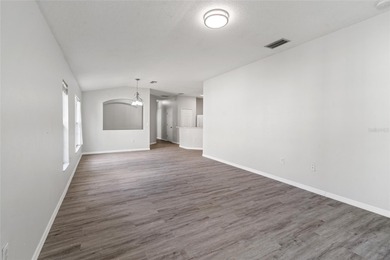 One or more photo(s) has been virtually staged. Step into a home on The Links of Lake Bernadette in Florida - for sale on GolfHomes.com, golf home, golf lot