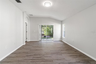 One or more photo(s) has been virtually staged. Step into a home on The Links of Lake Bernadette in Florida - for sale on GolfHomes.com, golf home, golf lot