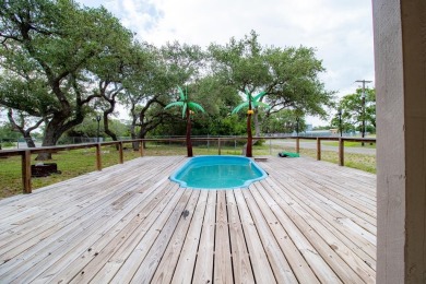 This is a Charming Coastal Retreat with detached barn nestled on Lamar Golf Course in Texas - for sale on GolfHomes.com, golf home, golf lot