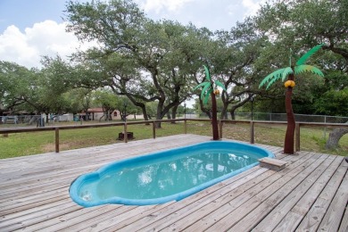 This is a Charming Coastal Retreat with detached barn nestled on Lamar Golf Course in Texas - for sale on GolfHomes.com, golf home, golf lot