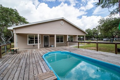 This is a Charming Coastal Retreat with detached barn nestled on Lamar Golf Course in Texas - for sale on GolfHomes.com, golf home, golf lot