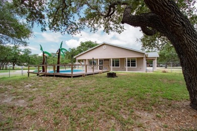 This is a Charming Coastal Retreat with detached barn nestled on Lamar Golf Course in Texas - for sale on GolfHomes.com, golf home, golf lot