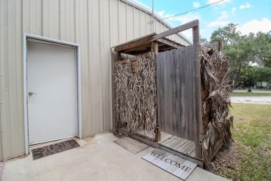 This is a Charming Coastal Retreat with detached barn nestled on Lamar Golf Course in Texas - for sale on GolfHomes.com, golf home, golf lot