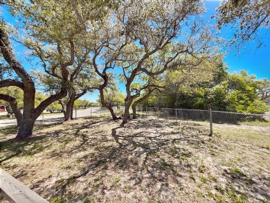 This is a Charming Coastal Retreat with detached barn nestled on Lamar Golf Course in Texas - for sale on GolfHomes.com, golf home, golf lot