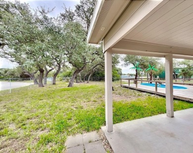 This is a Charming Coastal Retreat with detached barn nestled on Lamar Golf Course in Texas - for sale on GolfHomes.com, golf home, golf lot