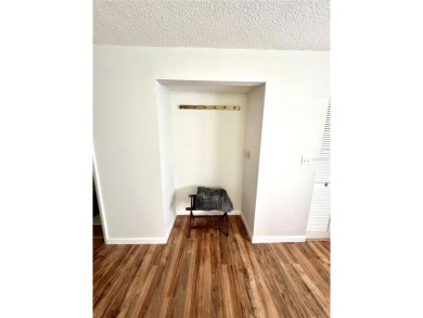 This spacious CORNER Unit located on the 14th Hole of Seven on Seven Springs Golf and Country Club in Florida - for sale on GolfHomes.com, golf home, golf lot