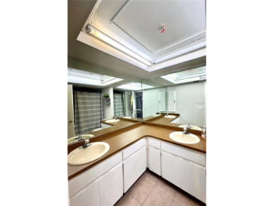 This spacious CORNER Unit located on the 14th Hole of Seven on Seven Springs Golf and Country Club in Florida - for sale on GolfHomes.com, golf home, golf lot
