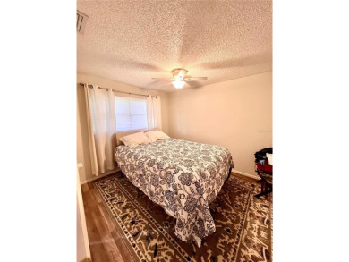 This spacious CORNER Unit located on the 14th Hole of Seven on Seven Springs Golf and Country Club in Florida - for sale on GolfHomes.com, golf home, golf lot