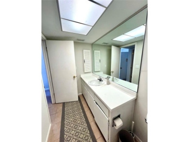 This spacious CORNER Unit located on the 14th Hole of Seven on Seven Springs Golf and Country Club in Florida - for sale on GolfHomes.com, golf home, golf lot