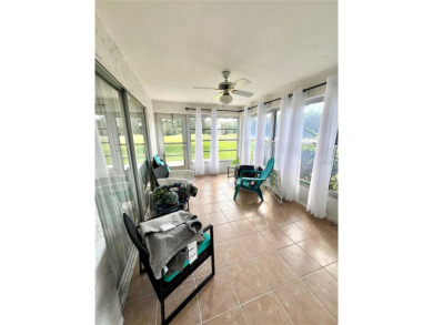 This spacious CORNER Unit located on the 14th Hole of Seven on Seven Springs Golf and Country Club in Florida - for sale on GolfHomes.com, golf home, golf lot