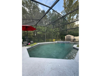 Welcome Home! This beautifully maintained 4-bedroom, 2-bathroom on Hunters Creek Golf Course in Florida - for sale on GolfHomes.com, golf home, golf lot
