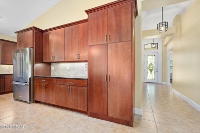 This custom home built 2018 sits on over  3/4  of an acre, in on Plantation Bay Golf and Country Club in Florida - for sale on GolfHomes.com, golf home, golf lot
