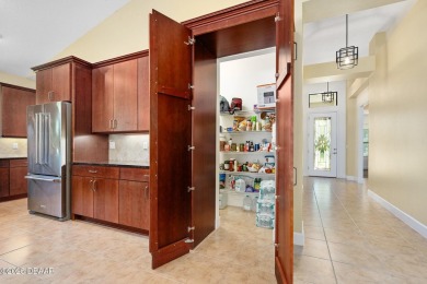 This custom home built 2018 sits on over  3/4  of an acre, in on Plantation Bay Golf and Country Club in Florida - for sale on GolfHomes.com, golf home, golf lot