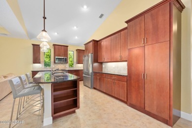 This custom home built 2018 sits on over  3/4  of an acre, in on Plantation Bay Golf and Country Club in Florida - for sale on GolfHomes.com, golf home, golf lot