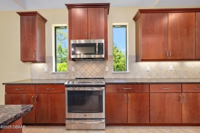 This custom home built 2018 sits on over  3/4  of an acre, in on Plantation Bay Golf and Country Club in Florida - for sale on GolfHomes.com, golf home, golf lot