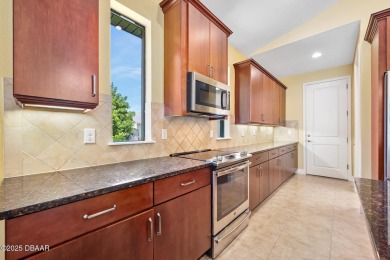 This custom home built 2018 sits on over  3/4  of an acre, in on Plantation Bay Golf and Country Club in Florida - for sale on GolfHomes.com, golf home, golf lot
