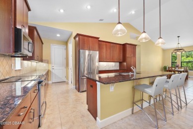 This custom home built 2018 sits on over  3/4  of an acre, in on Plantation Bay Golf and Country Club in Florida - for sale on GolfHomes.com, golf home, golf lot