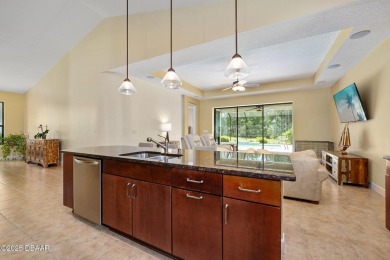 This custom home built 2018 sits on over  3/4  of an acre, in on Plantation Bay Golf and Country Club in Florida - for sale on GolfHomes.com, golf home, golf lot