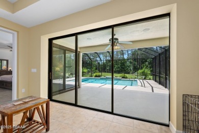 This custom home built 2018 sits on over  3/4  of an acre, in on Plantation Bay Golf and Country Club in Florida - for sale on GolfHomes.com, golf home, golf lot