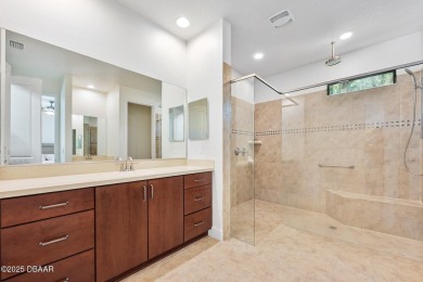 This custom home built 2018 sits on over  3/4  of an acre, in on Plantation Bay Golf and Country Club in Florida - for sale on GolfHomes.com, golf home, golf lot