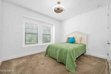 This custom home built 2018 sits on over  3/4  of an acre, in on Plantation Bay Golf and Country Club in Florida - for sale on GolfHomes.com, golf home, golf lot