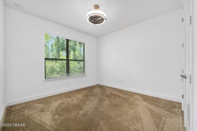 This custom home built 2018 sits on over  3/4  of an acre, in on Plantation Bay Golf and Country Club in Florida - for sale on GolfHomes.com, golf home, golf lot
