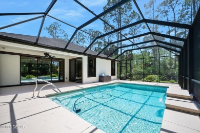 This custom home built 2018 sits on over  3/4  of an acre, in on Plantation Bay Golf and Country Club in Florida - for sale on GolfHomes.com, golf home, golf lot