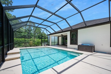 This custom home built 2018 sits on over  3/4  of an acre, in on Plantation Bay Golf and Country Club in Florida - for sale on GolfHomes.com, golf home, golf lot