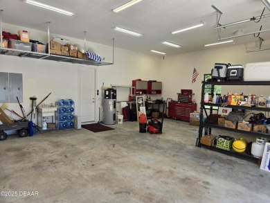 This custom home built 2018 sits on over  3/4  of an acre, in on Plantation Bay Golf and Country Club in Florida - for sale on GolfHomes.com, golf home, golf lot