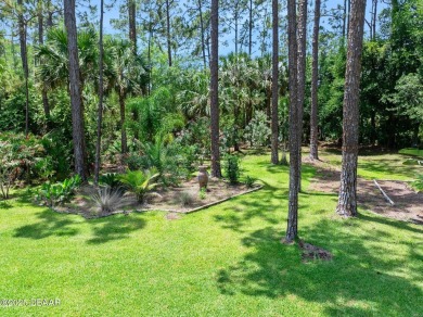 This custom home built 2018 sits on over  3/4  of an acre, in on Plantation Bay Golf and Country Club in Florida - for sale on GolfHomes.com, golf home, golf lot