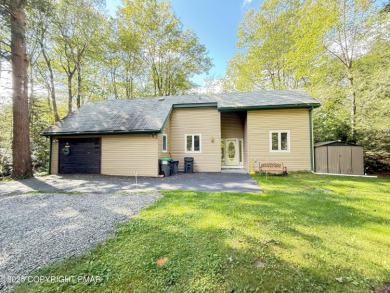 Nestled on a wooded lot backing up to the golf course, this on Pocono Farms Country Club in Pennsylvania - for sale on GolfHomes.com, golf home, golf lot