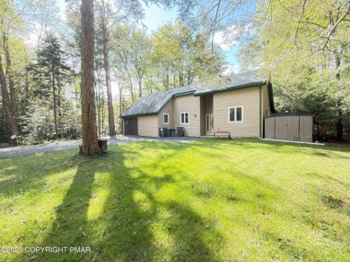 Nestled on a wooded lot backing up to the golf course, this on Pocono Farms Country Club in Pennsylvania - for sale on GolfHomes.com, golf home, golf lot