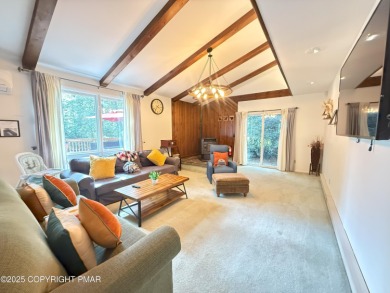 Nestled on a wooded lot backing up to the golf course, this on Pocono Farms Country Club in Pennsylvania - for sale on GolfHomes.com, golf home, golf lot