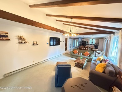 Nestled on a wooded lot backing up to the golf course, this on Pocono Farms Country Club in Pennsylvania - for sale on GolfHomes.com, golf home, golf lot