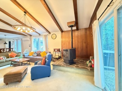 Nestled on a wooded lot backing up to the golf course, this on Pocono Farms Country Club in Pennsylvania - for sale on GolfHomes.com, golf home, golf lot