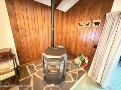 Nestled on a wooded lot backing up to the golf course, this on Pocono Farms Country Club in Pennsylvania - for sale on GolfHomes.com, golf home, golf lot