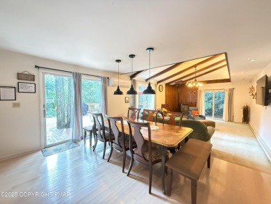 Nestled on a wooded lot backing up to the golf course, this on Pocono Farms Country Club in Pennsylvania - for sale on GolfHomes.com, golf home, golf lot