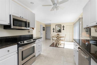 Absolutely Charming home nestled on a large fenced yard along a on Port Charlotte Golf Club in Florida - for sale on GolfHomes.com, golf home, golf lot