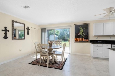 Absolutely Charming home nestled on a large fenced yard along a on Port Charlotte Golf Club in Florida - for sale on GolfHomes.com, golf home, golf lot