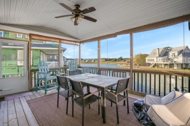 Waterfront house with paved area underneath and nice landscaping on Captains Cove Golf and Yacht Club in Virginia - for sale on GolfHomes.com, golf home, golf lot