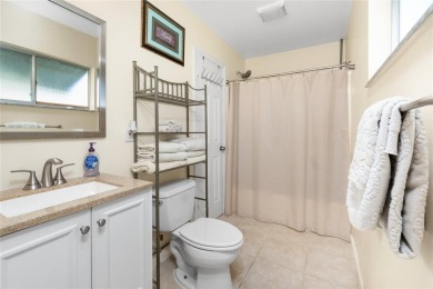 Absolutely Charming home nestled on a large fenced yard along a on Port Charlotte Golf Club in Florida - for sale on GolfHomes.com, golf home, golf lot