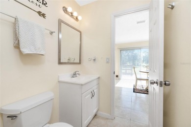 Absolutely Charming home nestled on a large fenced yard along a on Port Charlotte Golf Club in Florida - for sale on GolfHomes.com, golf home, golf lot