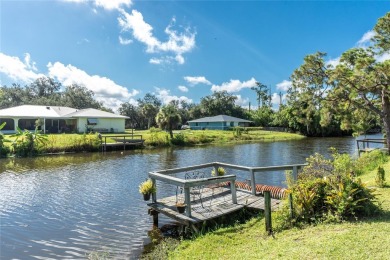 Absolutely Charming home nestled on a large fenced yard along a on Port Charlotte Golf Club in Florida - for sale on GolfHomes.com, golf home, golf lot