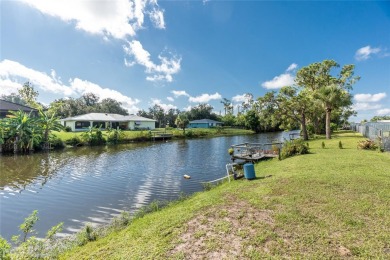 Absolutely Charming home nestled on a large fenced yard along a on Port Charlotte Golf Club in Florida - for sale on GolfHomes.com, golf home, golf lot