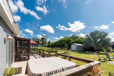 Absolutely Charming home nestled on a large fenced yard along a on Port Charlotte Golf Club in Florida - for sale on GolfHomes.com, golf home, golf lot